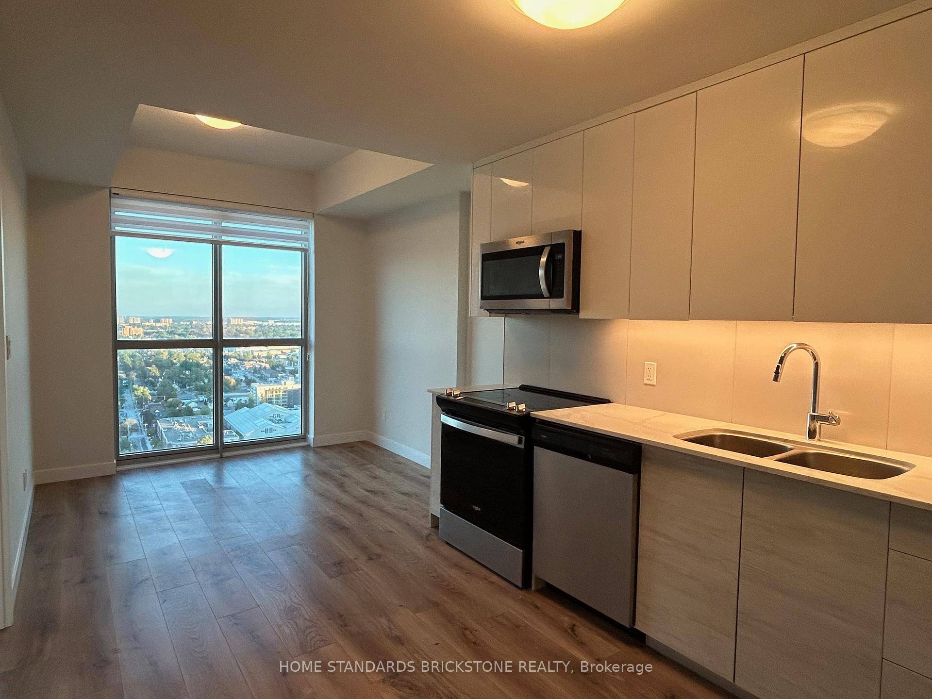 Clean and modern 1 bedroom unit featuring floor to ceiling windows with clear, unobstructed views.