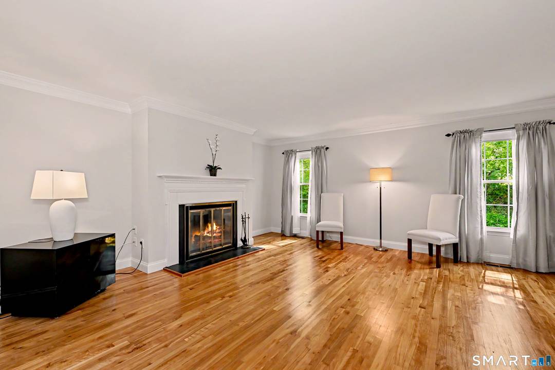 Tucked away in a private, tree lined complex with a peaceful wooded setting, this updated Georgian style townhouse offers comfort, convenience, and outstanding commuter access.
