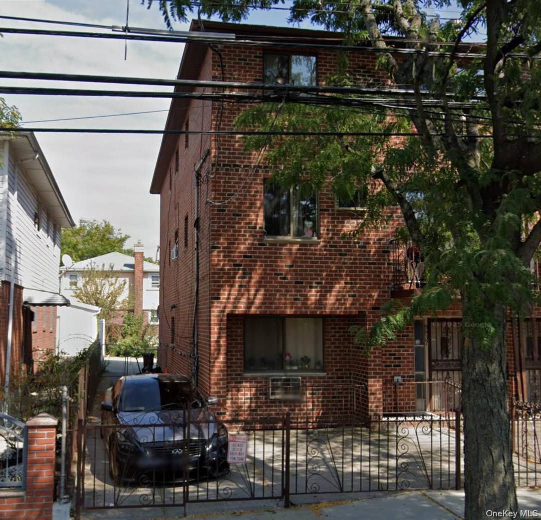 This residential income triplex in Ozone Park, Queens offers a total of 10 bedrooms and 6 full bathrooms across three units.