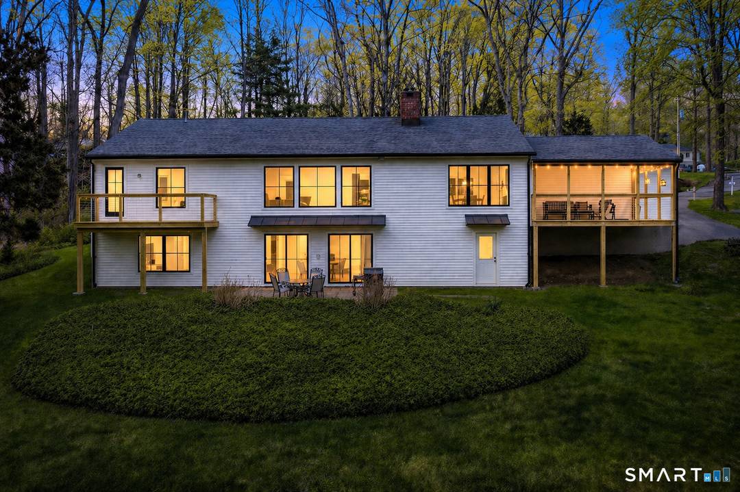 Located in the highly sought after Charcoal Hill neighborhood, this home sits on 2 private acres bordering a 7 acre Aspetuck Land Trust preserve.
