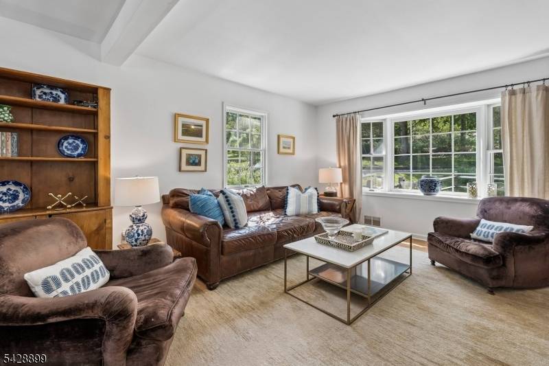 Perfectly positioned on a half acre lot with an expansive setback, this charming 4 bedrm, 2 bath Cape Cod is nestled in one of Morris Township's most sought after neighborhoods.