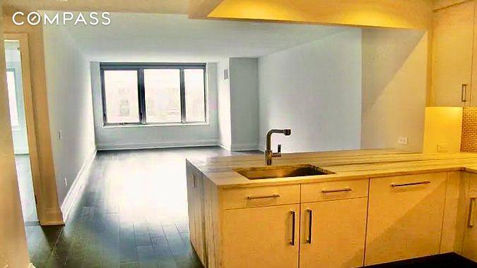 This 856 square foot, one bedroom, one bath residence offers beautiful southern exposure and warm, modern, elegant interiors by Shamir Shah Design.