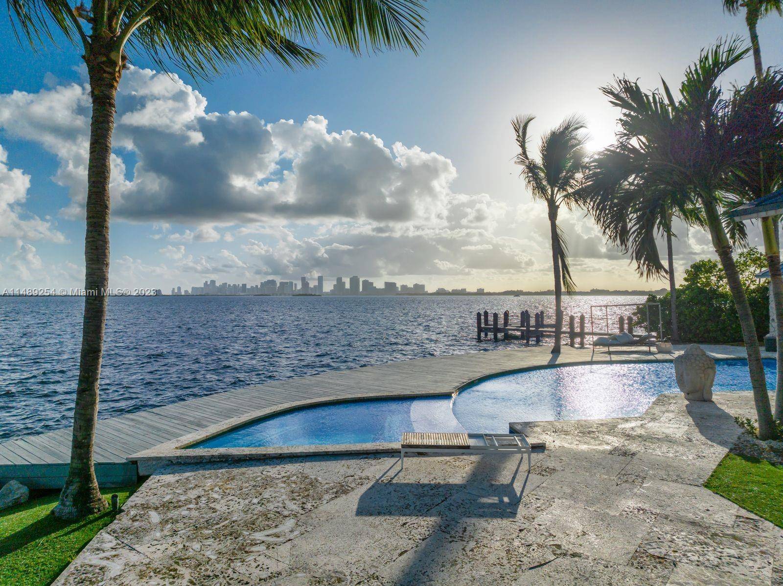 One of South Florida's most exceptional waterfront properties, boasting 215 feet on the open bay and featuring stunning views of downtown Miami and Miami Beach from your own backyard.