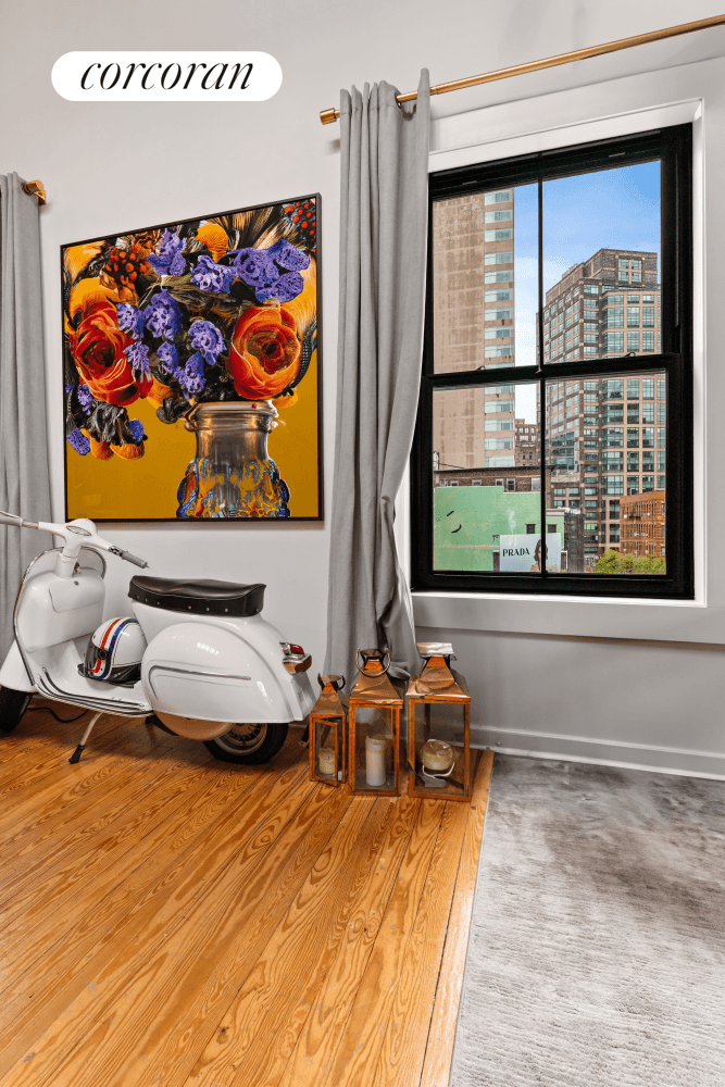 Perched on the top floor of a charming four story walk up, this full floor duplex loft at 53 Grand Street captures the essence of classic SoHo living.