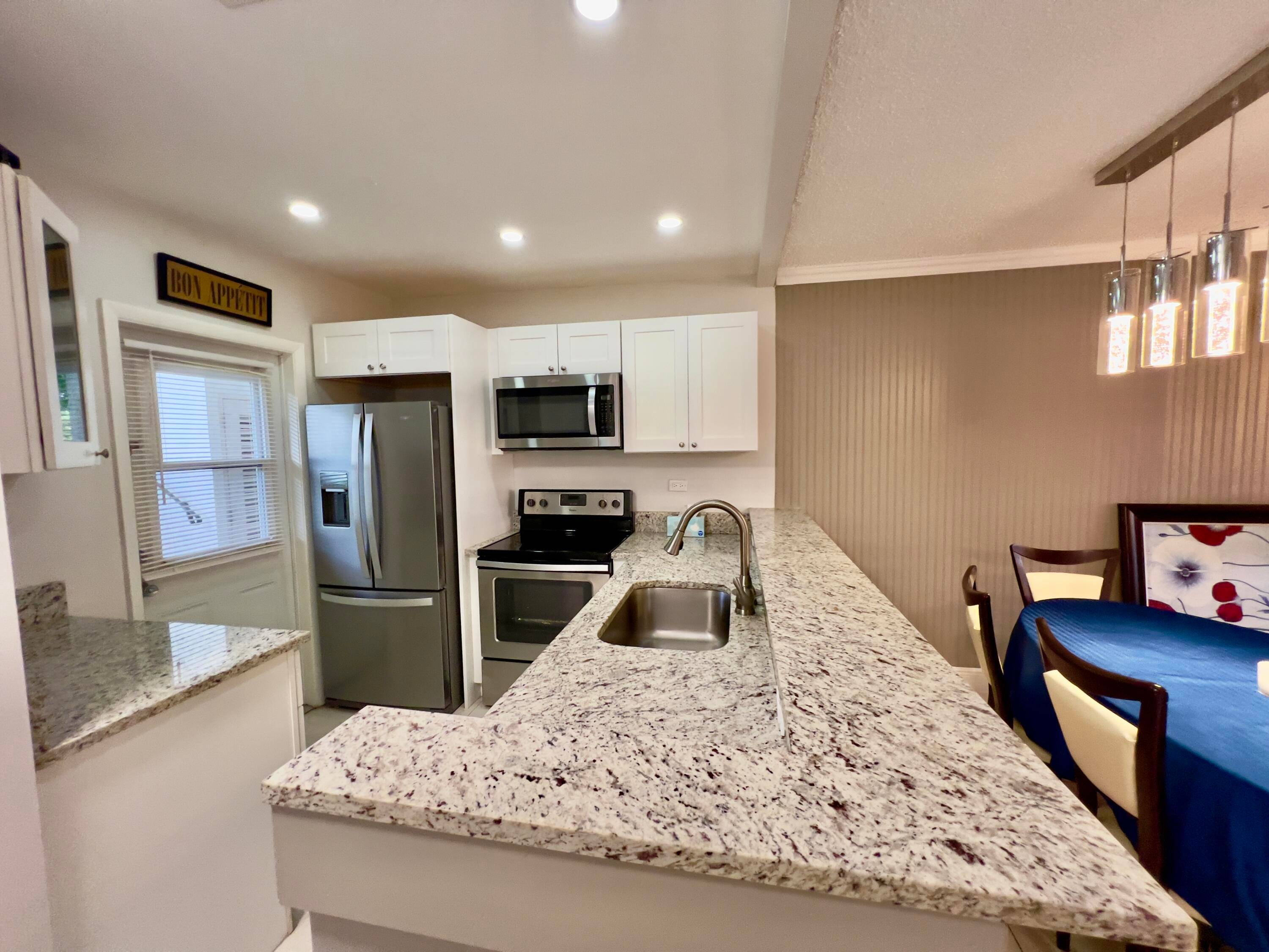 Cozy ground floor condo in Quince Gardens at Hawaiian Gardens, a 55 community.