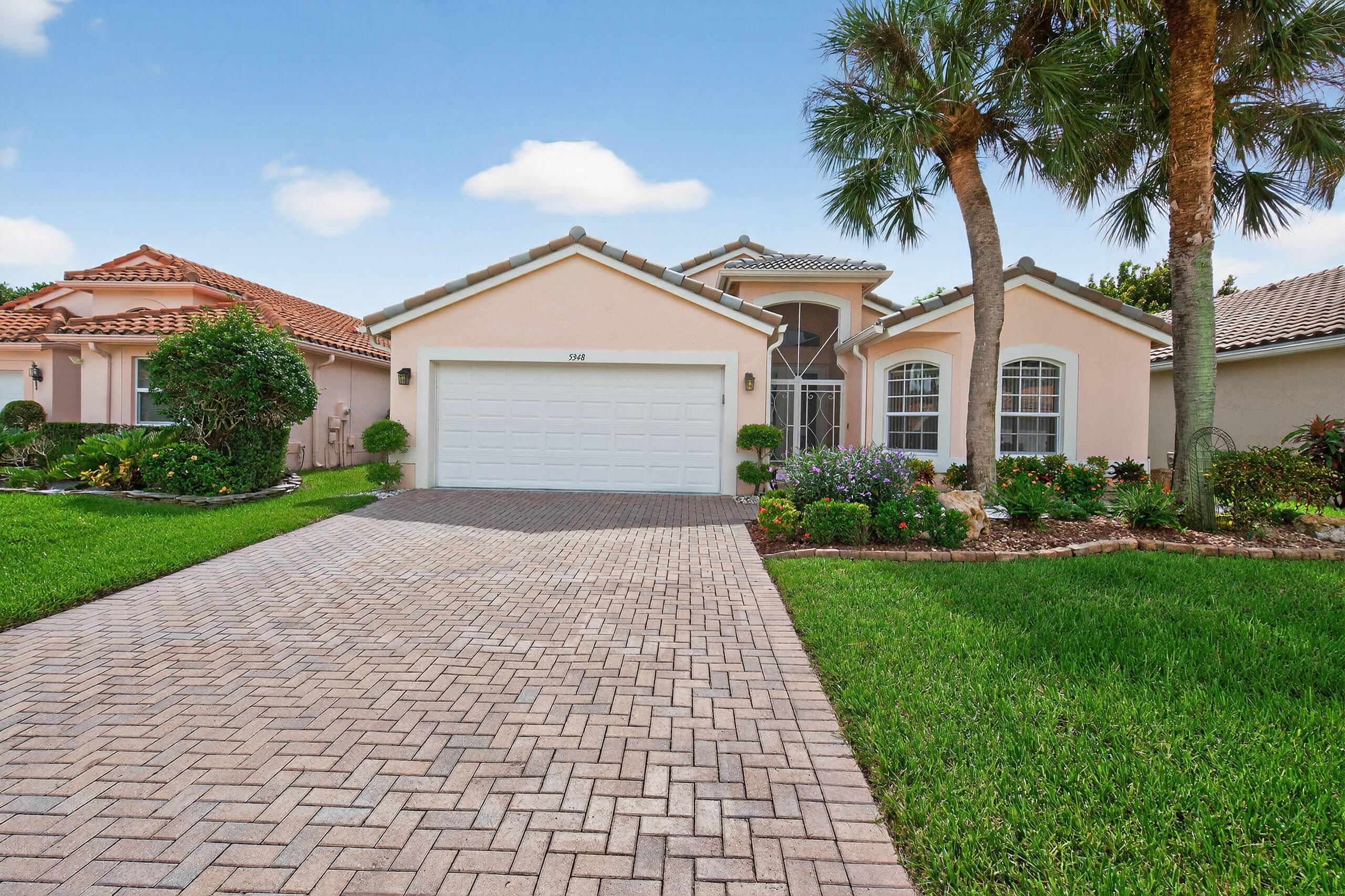 Light, bright and absolutely lovely 3 2 home with attached 2 car garage.