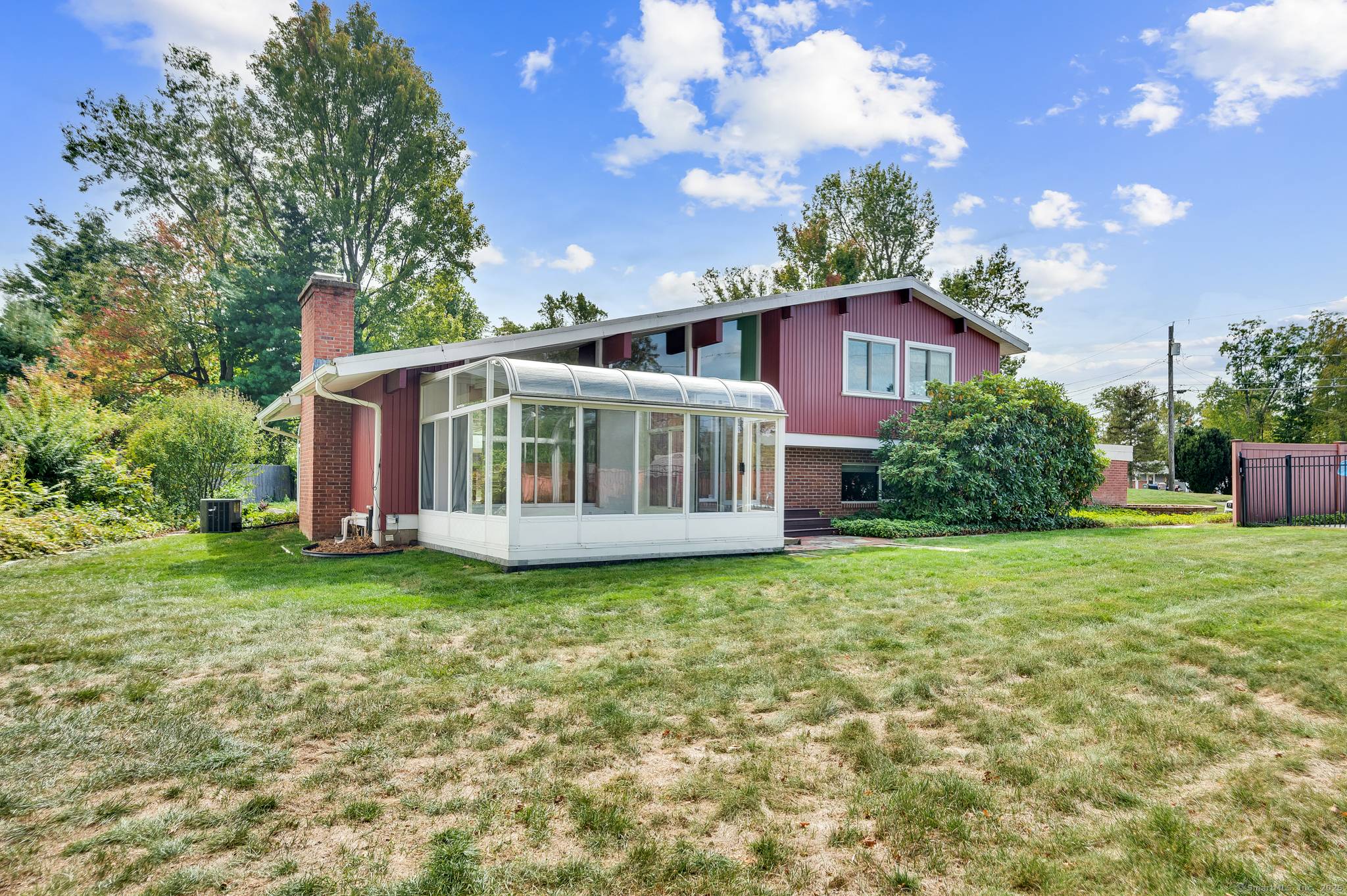 You will fall in love with this spacious midcentury modern home situated in a quiet neighborhood in Hamden.