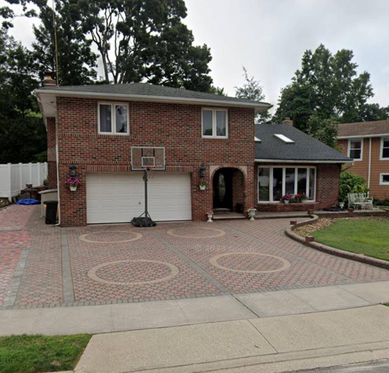 Occupied No Access Investor Opportunity Split level home in the heart of Plainview featuring approx.