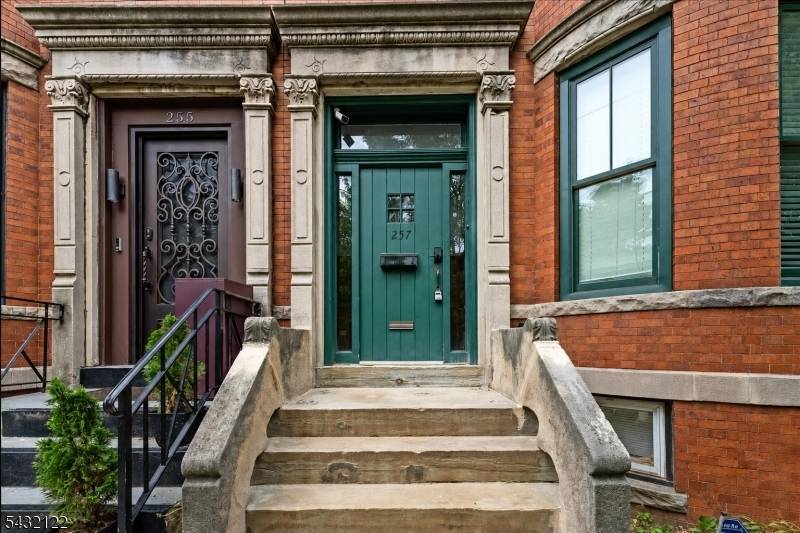 Stunning 5 bedroom brownstone in the heart of Jersey City, blending timeless charm with modern living on a quiet, tree lined street just moments from parks, cafes, shops, and easy ...
