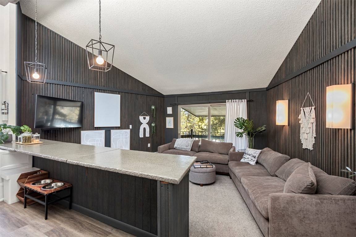 Spacious top floor 2 BR, 1 BA unit boasts vaulted ceilings, extra windows, open floor plan AND faces southeast for optimal sun, views and quiet.