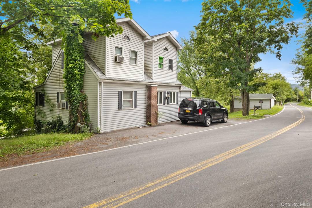 A spacious 3 bed, 2 bath single family home with a heated, electric equipped detached two car garage perfect for a studio, workshop, or small business.