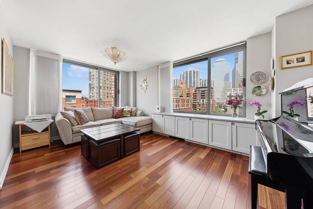 Perched on the top floor of the prestigious Cove Club condominium, 2 bedroom, 2 bathroom home offering an exceptional blend of elegance, light, and iconic New York City views.