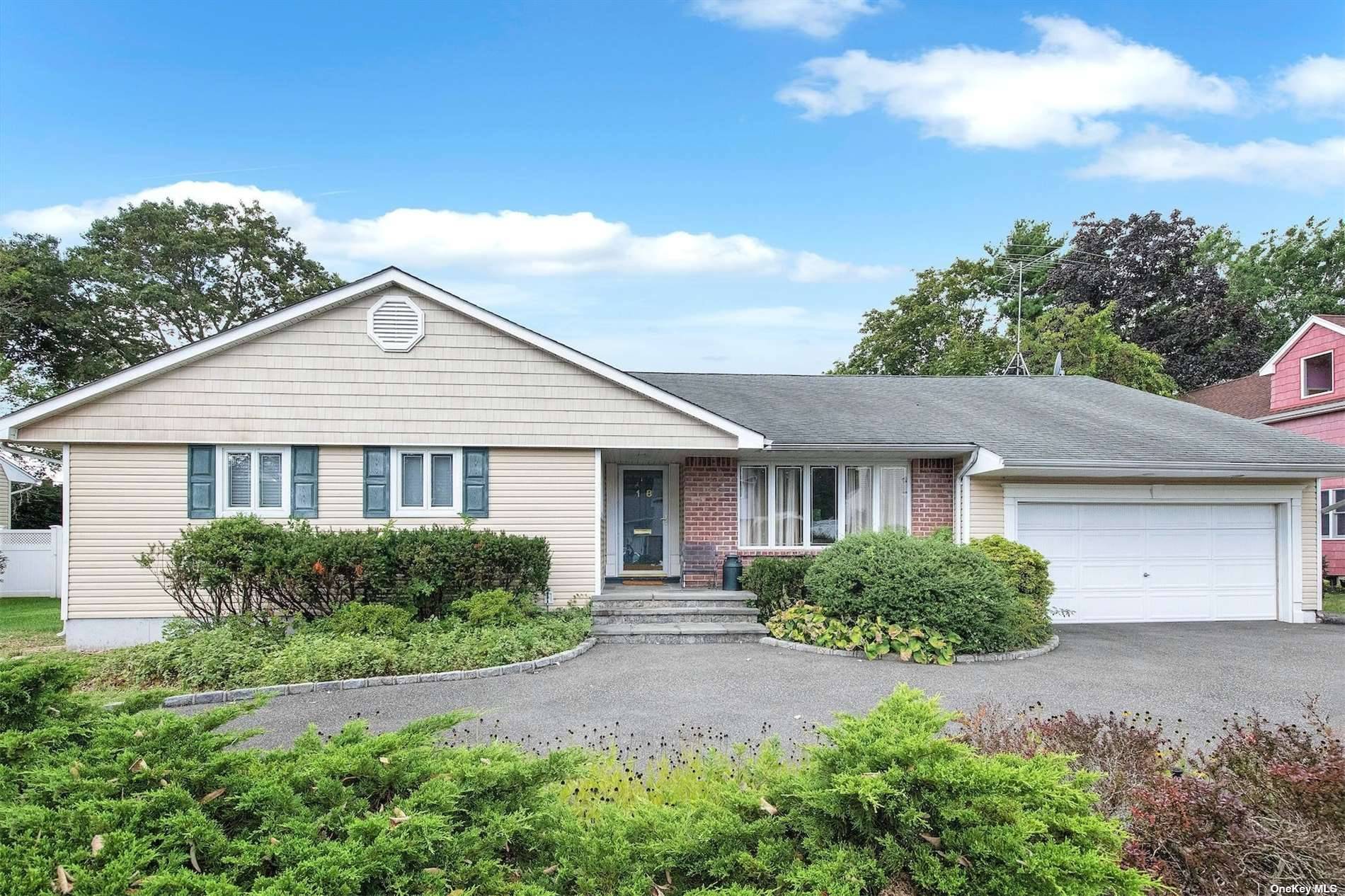 Circular Driveway leads to this three bedroom Expanded ranch with a Formal Living and Dining Room, Den, Eat in kitchen, Primary Suite plus Two additional Bedrooms and Bath.