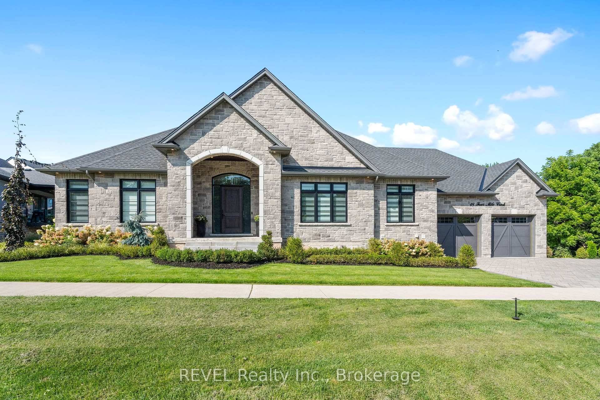 Welcome to this stunning custom built stone bungalow with 2, 750 sqft of finished living space, on a large irregular pie shaped lot with mature trees.