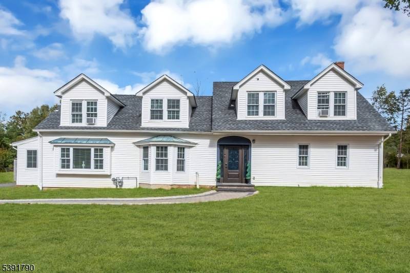 This remarkable custom Colonial masterfully combines historic charm with refined modern living.