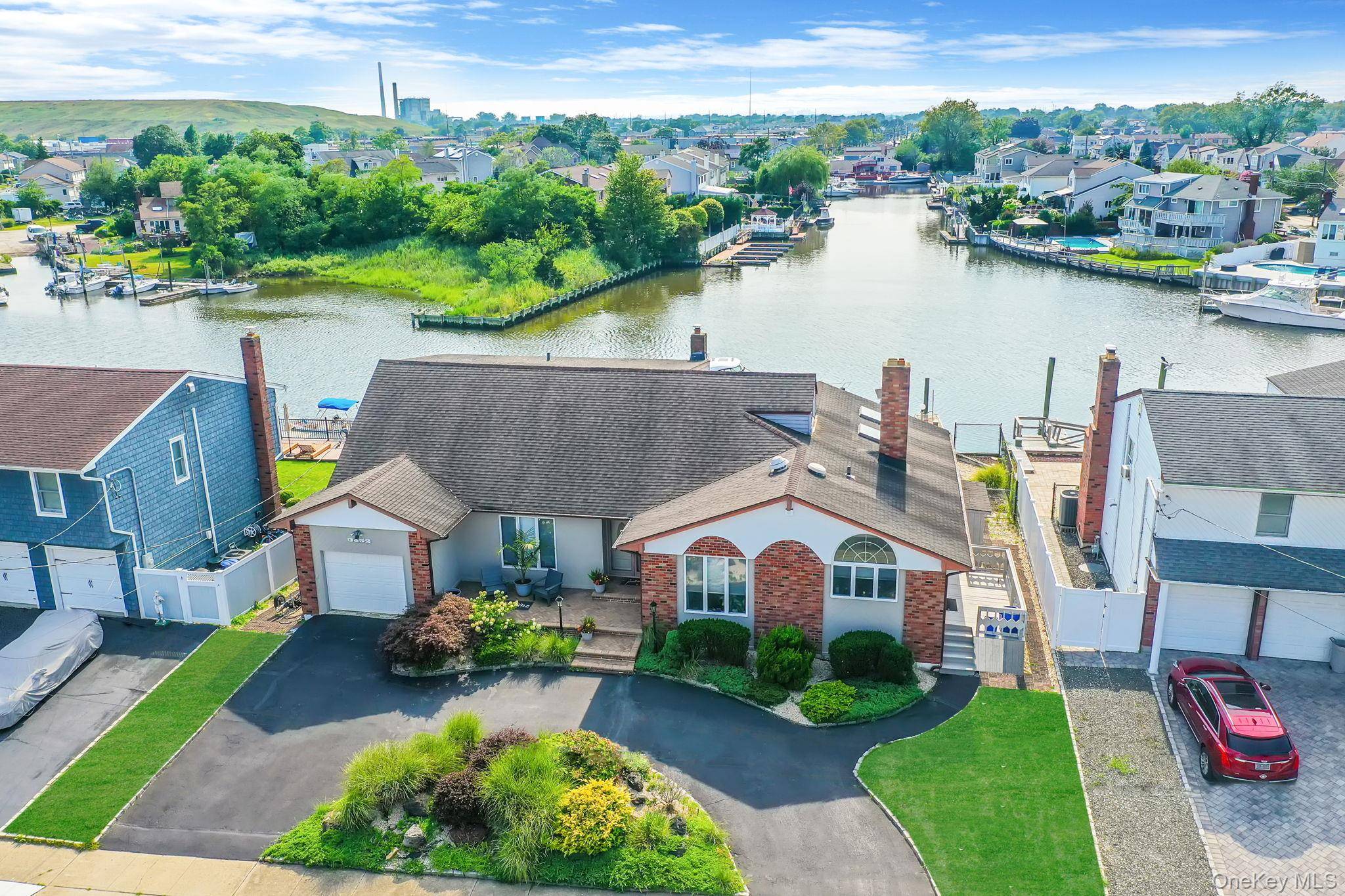 Live the dream on this rare 80 foot wide waterfront property !