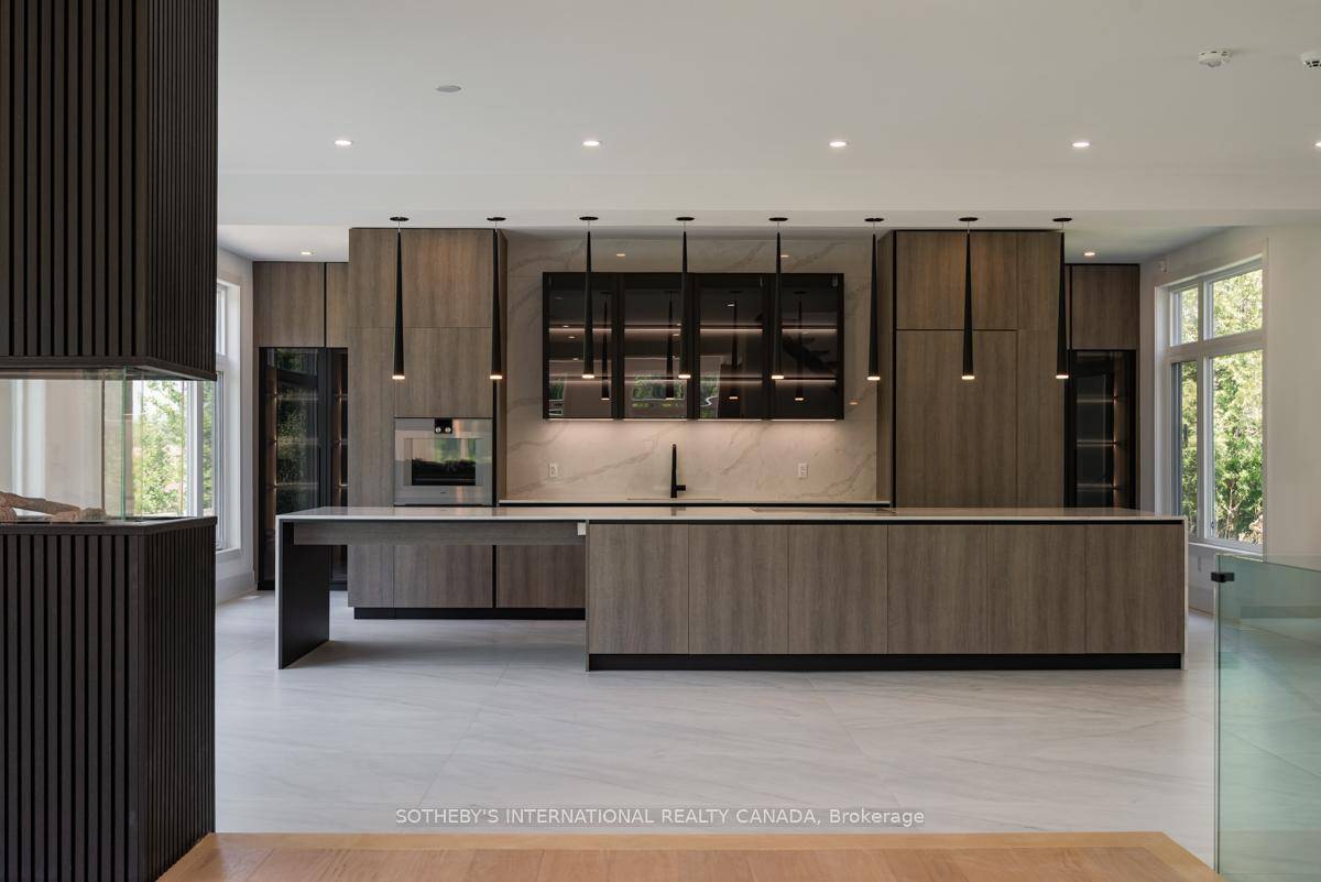 Nestled within the rolling hills of Caledon East, this newly constructed contemporary home offers an unparalleled blend of modern luxury and tranquil rural living on ten acres.