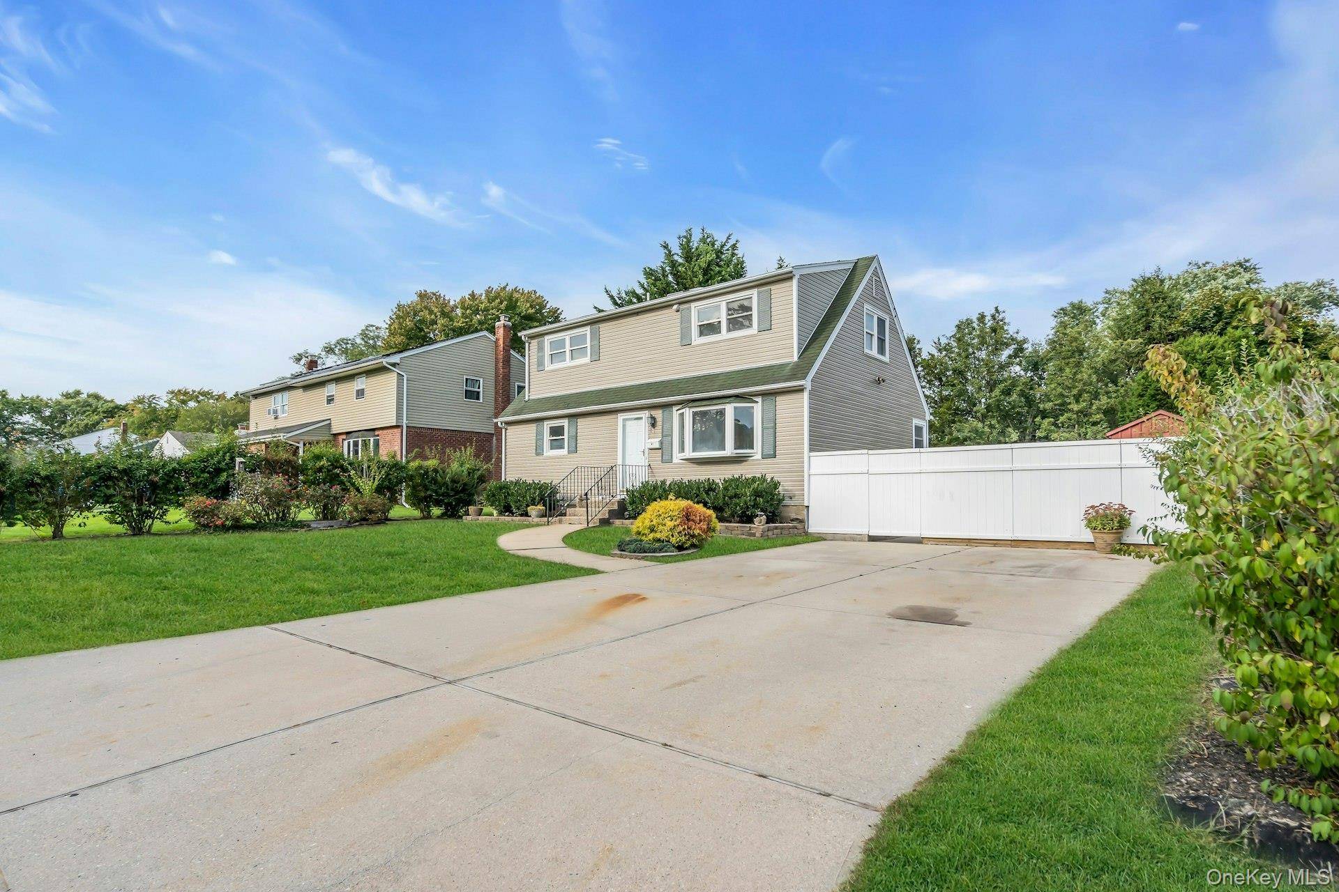 Welcome to this expanded 4 bedroom, 2 bath Cape in Centereach featuring a full basement and freshly painted interior.