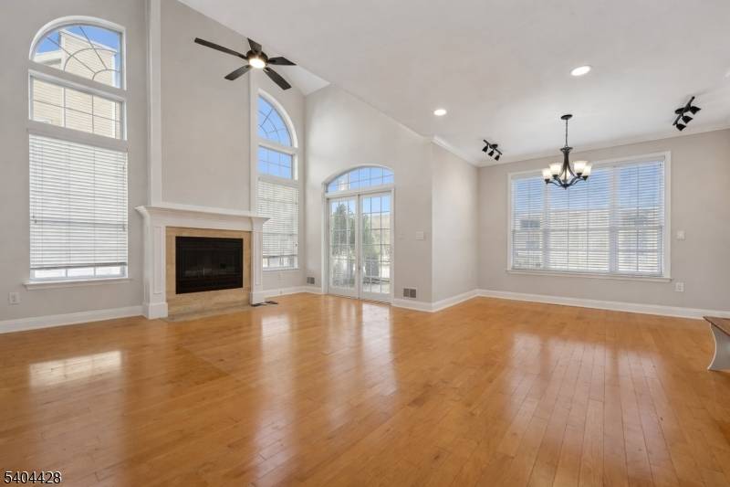 Welcome to this bright end unit town home, now available for annual rental in the desired Arbor Rose community.