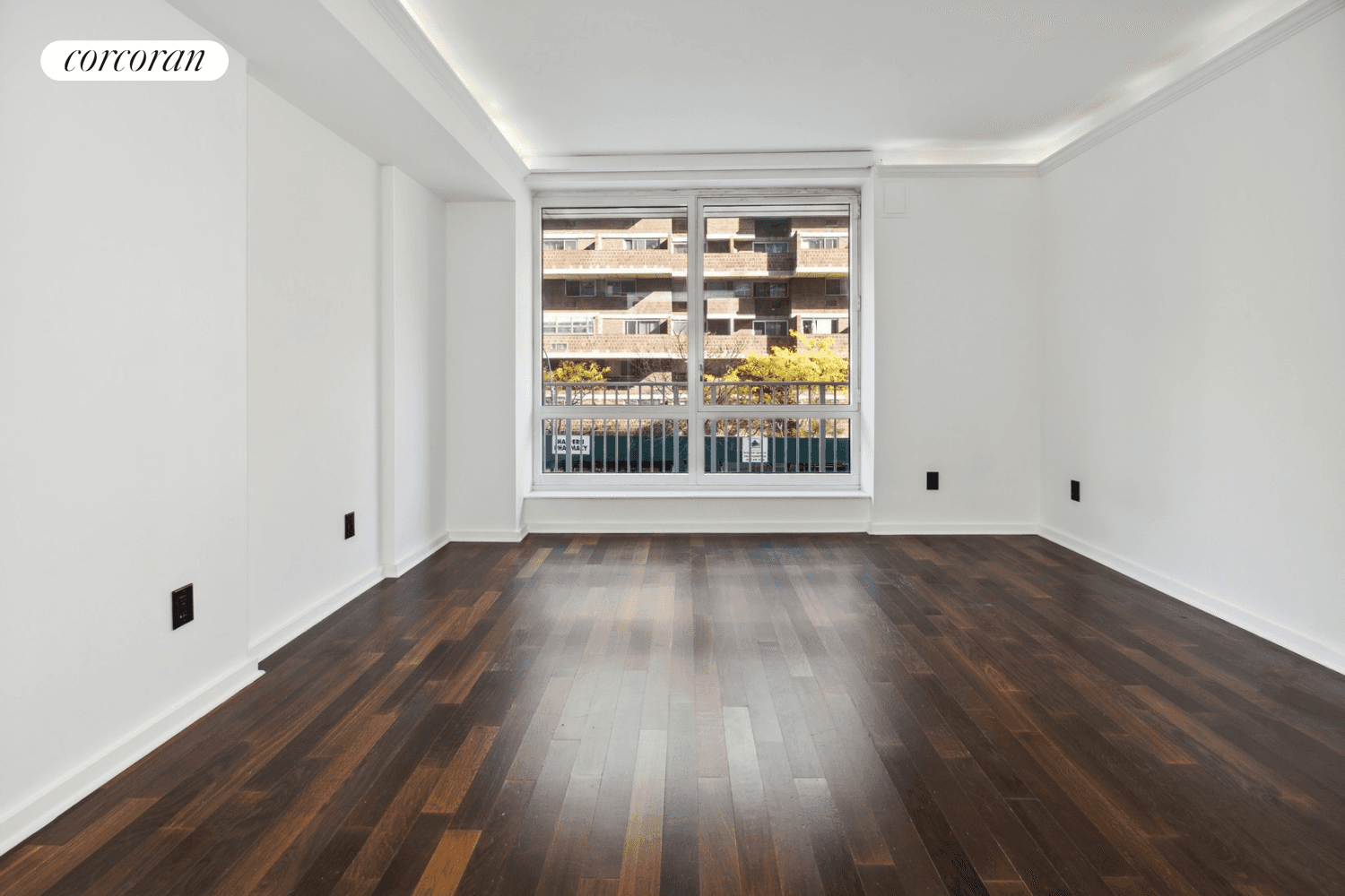 This studio boasts floor to ceiling windows and brand new wood floors throughout.