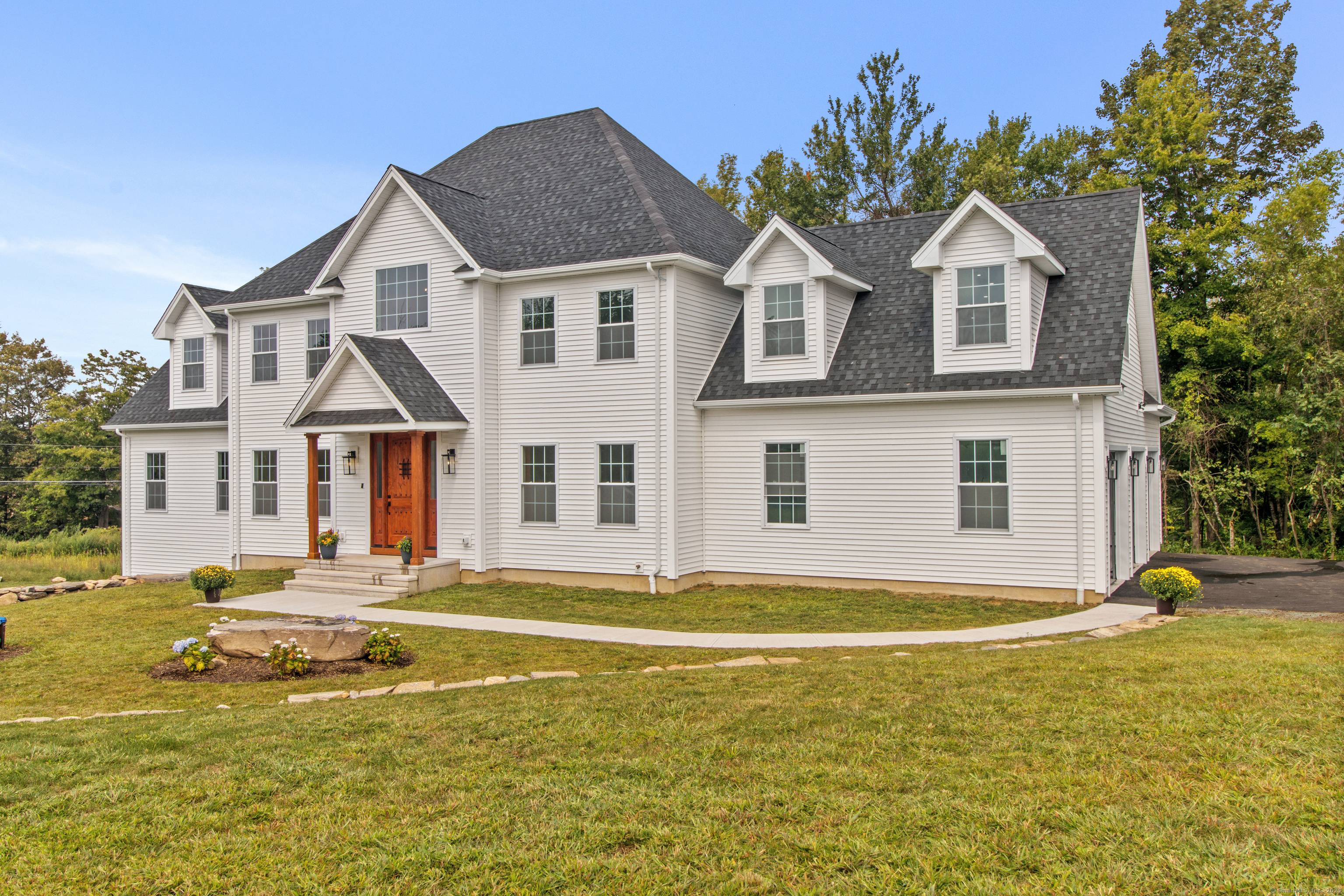 Welcome to 20 Stone House a stunning, newly built modern farmhouse that offers warmth and elegance from the moment you step through the grand front door.