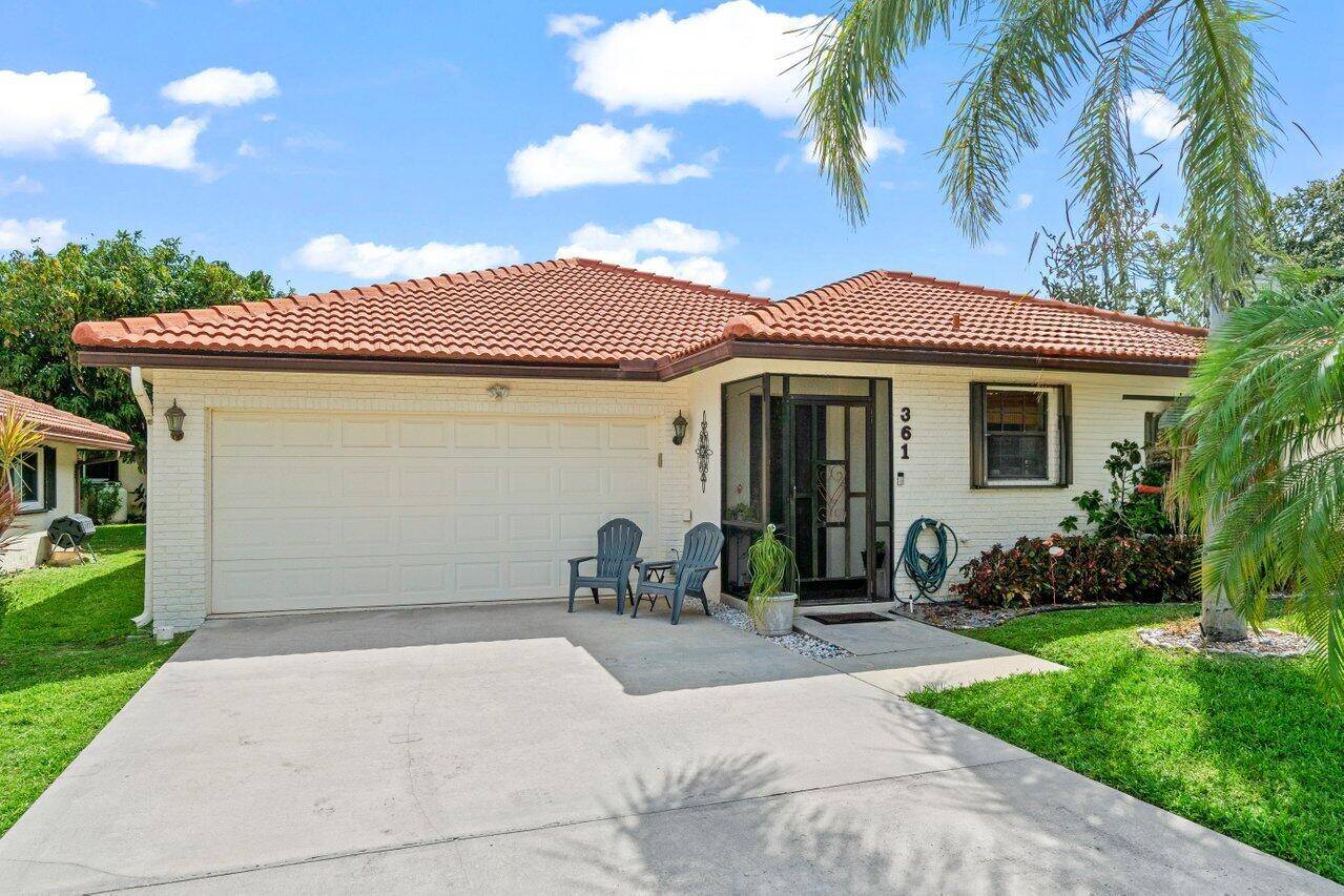 Charming one story 2 bedroom PLUS den, 2 bathroom single family home in East Boca Raton's Knob Hill 55 community.