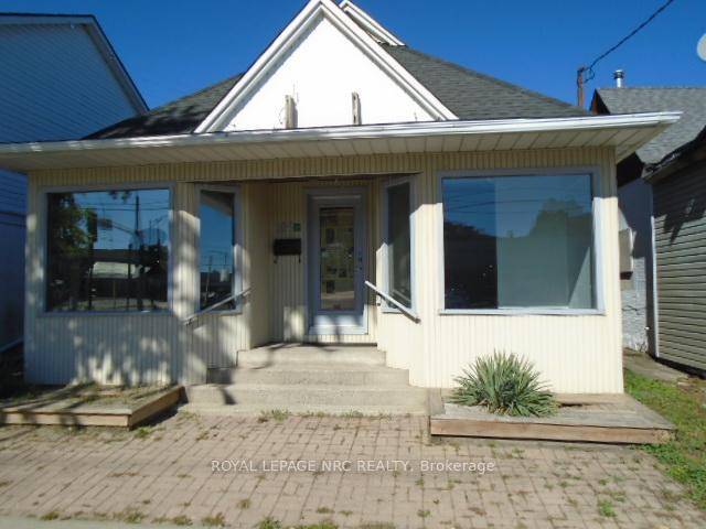 Commercial zoned C2 building on main artery of Welland Ave across from Midtown plaza.