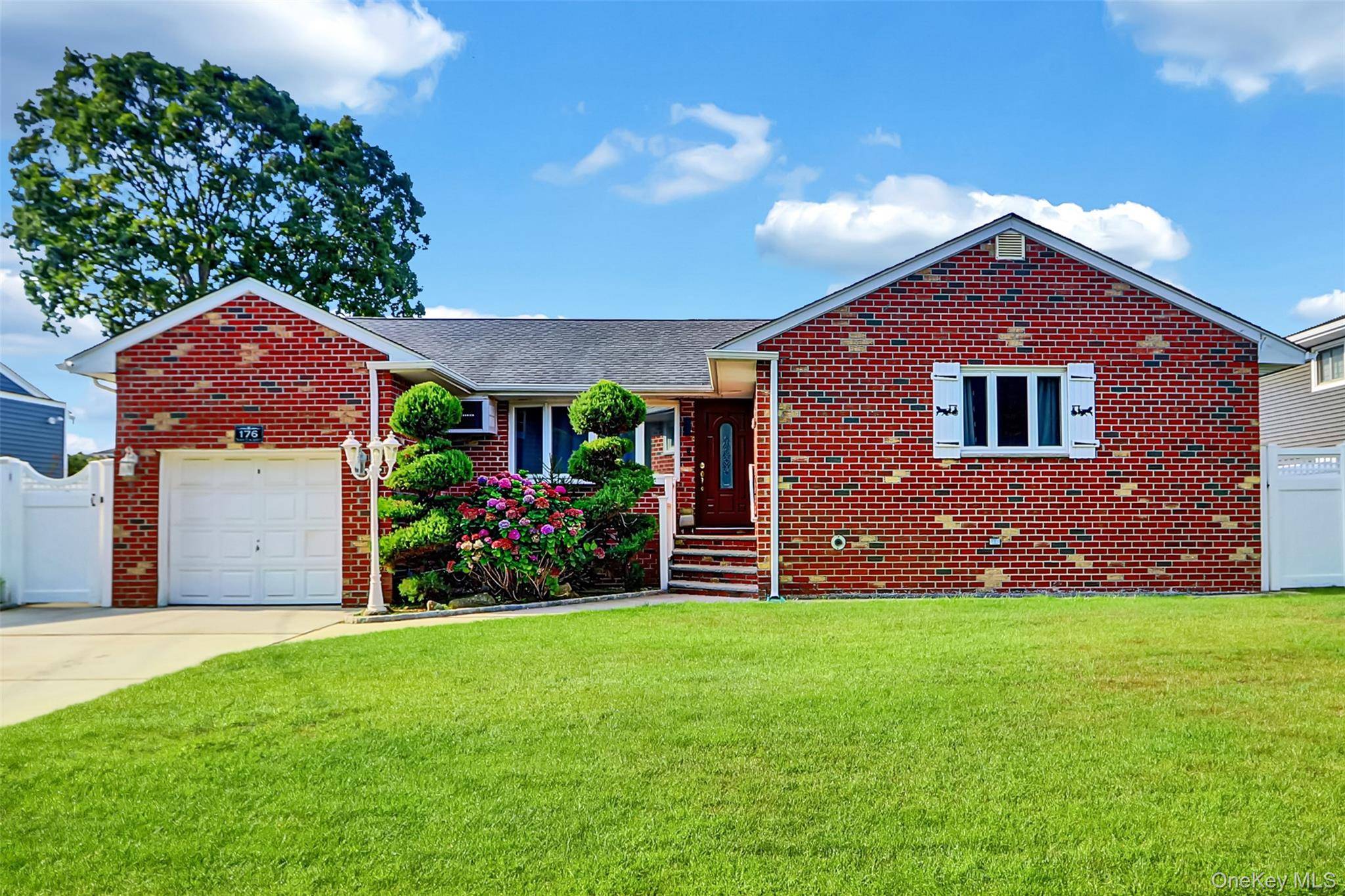 Welcome to this charming expanded wide line brick Ranch, ideally nestled at 176 North Elm Street in Massapequa.