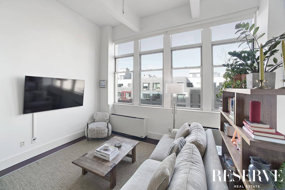 Light and living space are plentiful in this alcove studio loft in the highly sought after Gretsch Condominium.