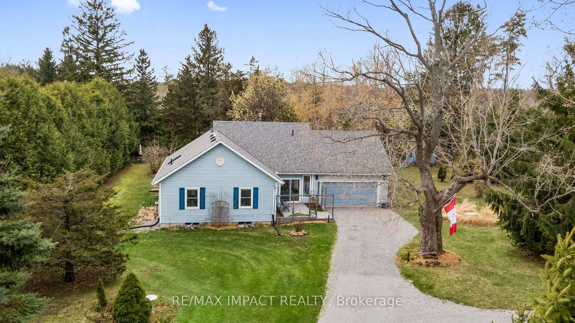 This charming home perfectly blends the convenience of town living with the serenity of a large, private lot.