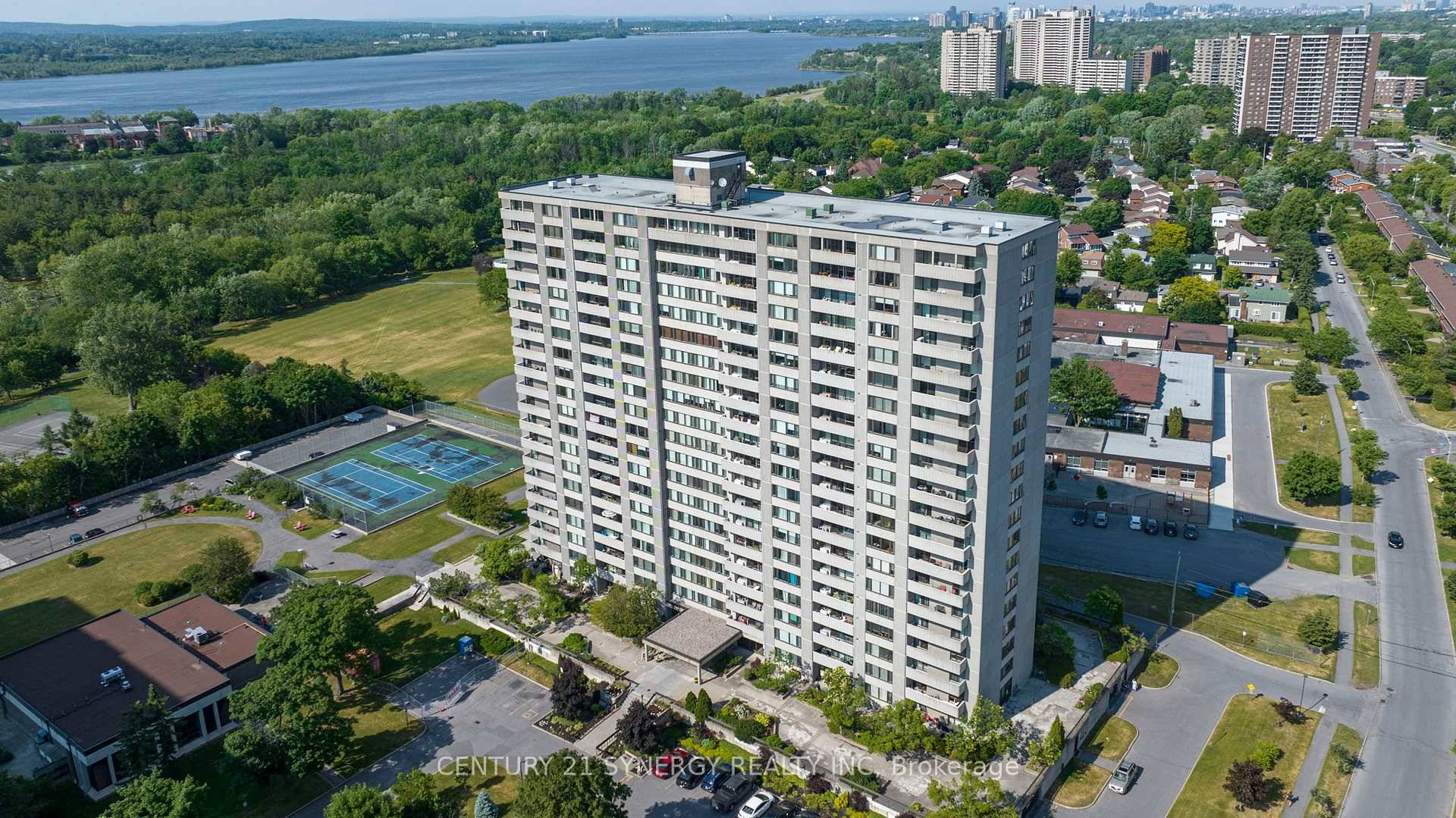 Welcome to this exceptional 9th floor corner unit at Northwest One, offering expansive panoramic views of the Ottawa River, Mud Lake, and scenic NCC pathways.