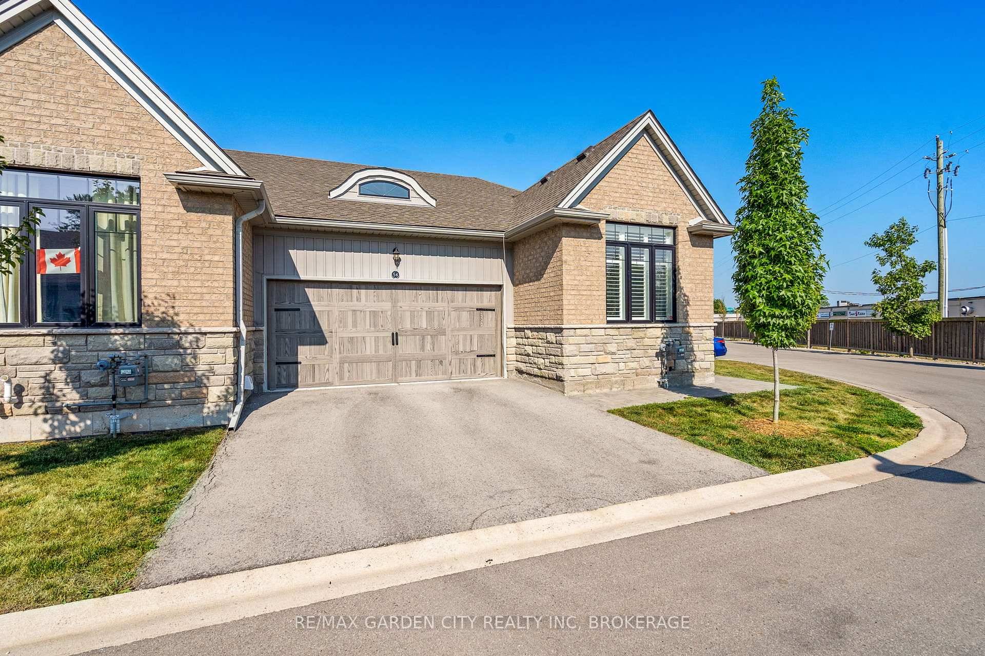 Sought After End Unit Bungalow Townhome in the Village on Prince Charles.