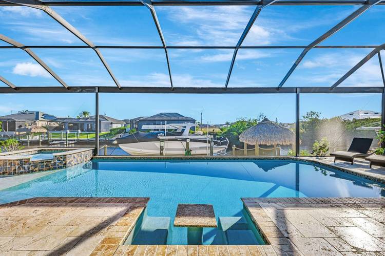 Experience luxury waterfront living in this 2018 ICF built home featuring steel reinforced concrete walls, 2 owner s suites, Gulf access, a heated pool, composite dock, tiki hut, and 16k ...