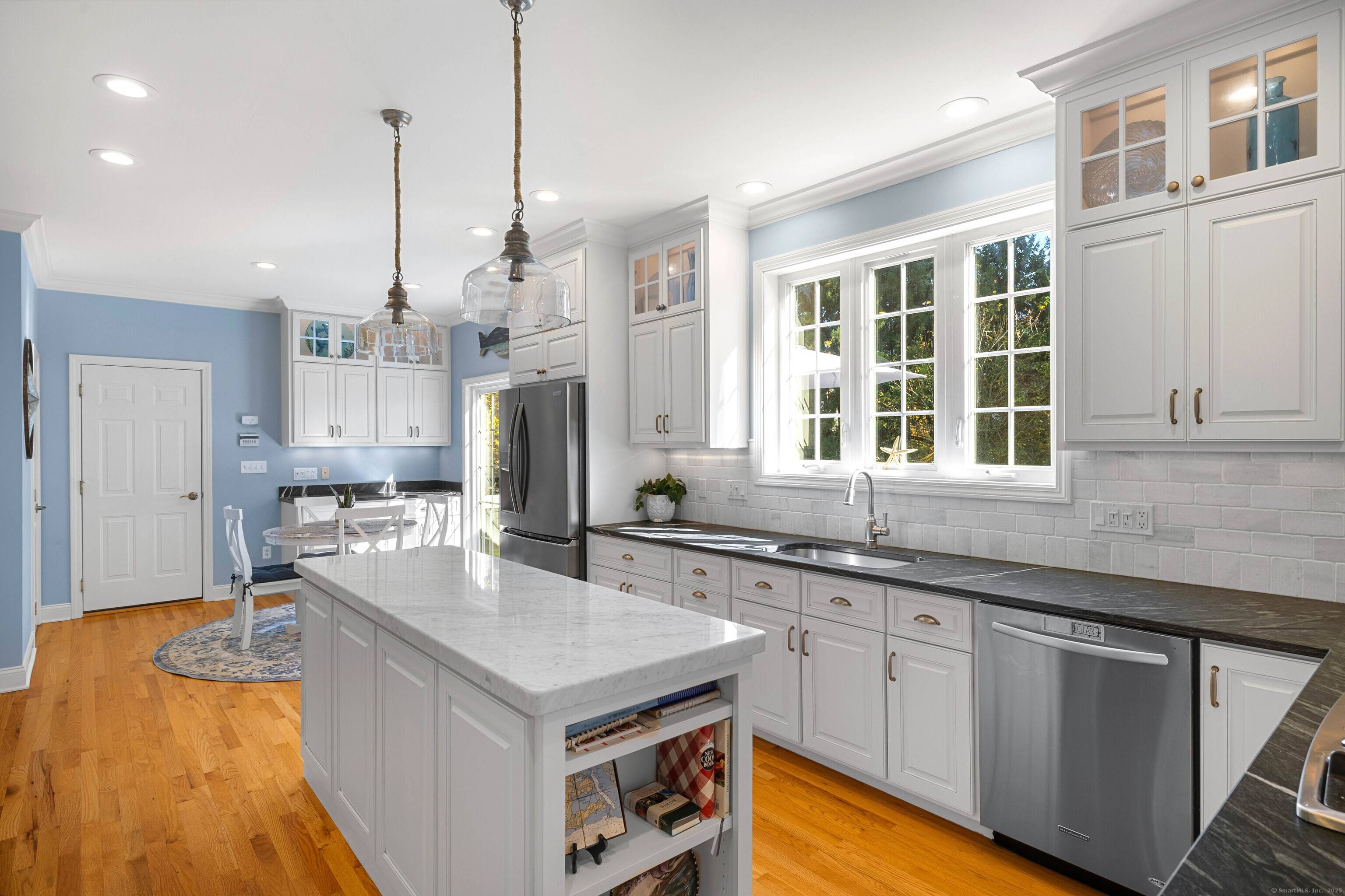 Welcome to this meticulously maintained custom built home offering a blend of elegance and comfort.