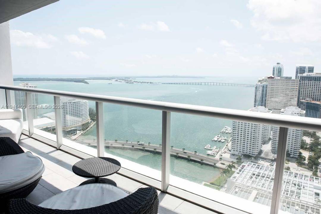 Breathtaking bay view from this 38th floor decorator inspired 2bed den unit in Tower 2 of prestigious Icon Brickell.