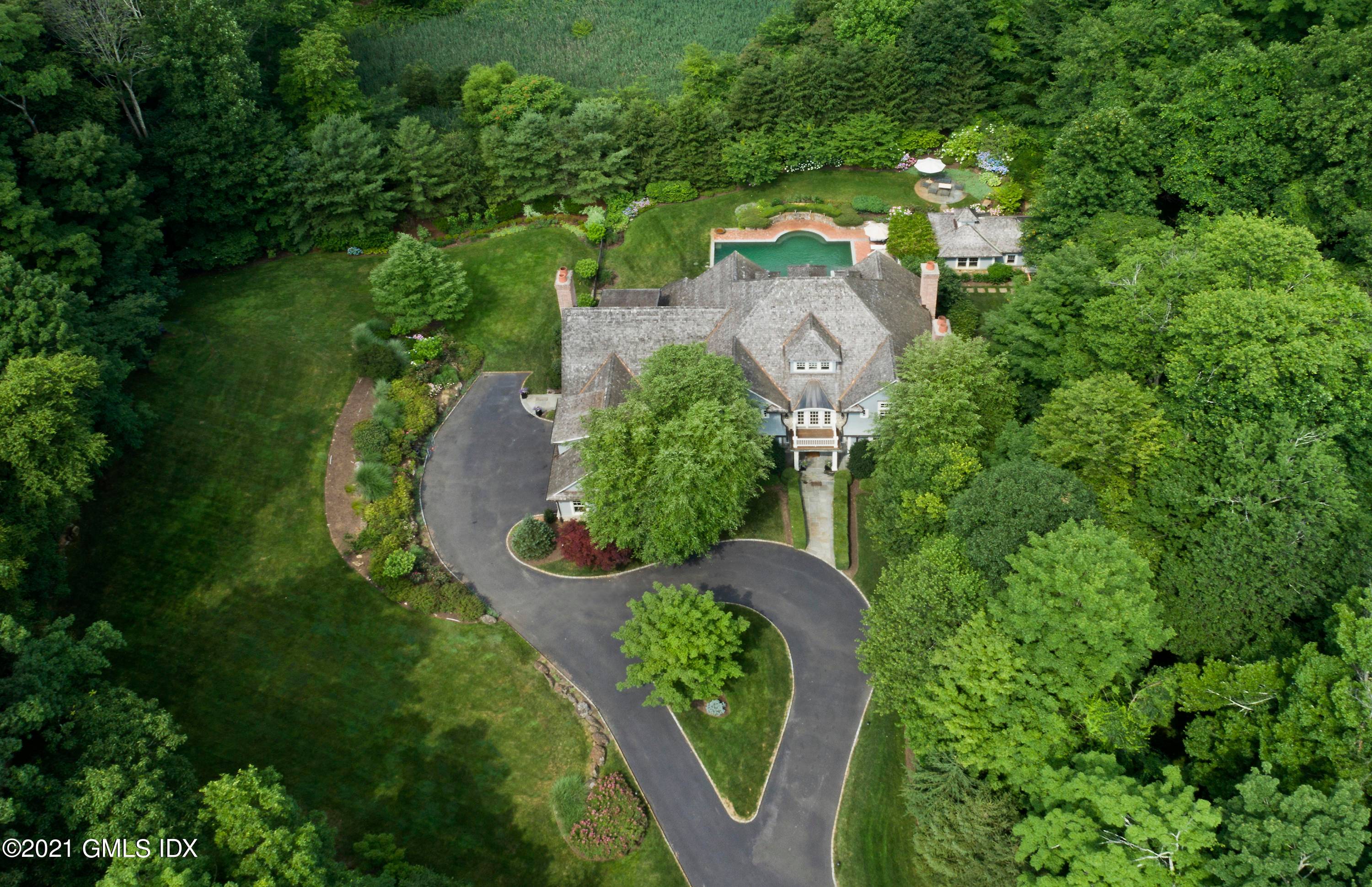 Better than new ! Magnificent 6 bedroom stone shingle Colonial by famed Granoff Architects sited on a private 4.
