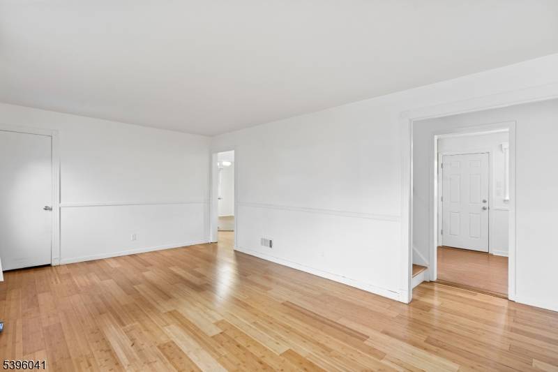 Welcome to this spacious and beautifully upgraded Cape Cod home surrounded by lush greenery and mature landscaping.