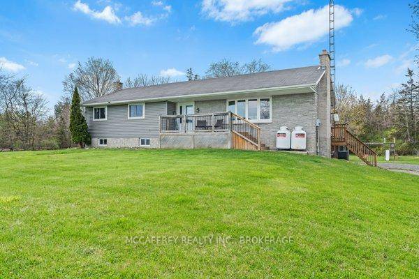 Nestled in a private country setting, this charming bungalow offers a perfect blend of tranquility and convenience.