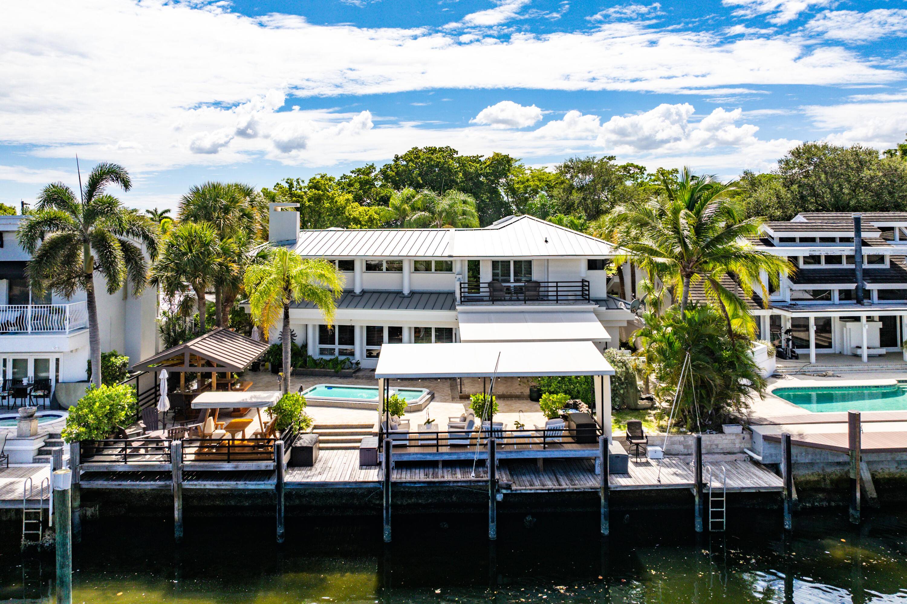 Experience elevated waterfront living in this exceptional Pompano Beach residence, boasting 70 ft of prime Intracoastal frontage with no fixed bridges.
