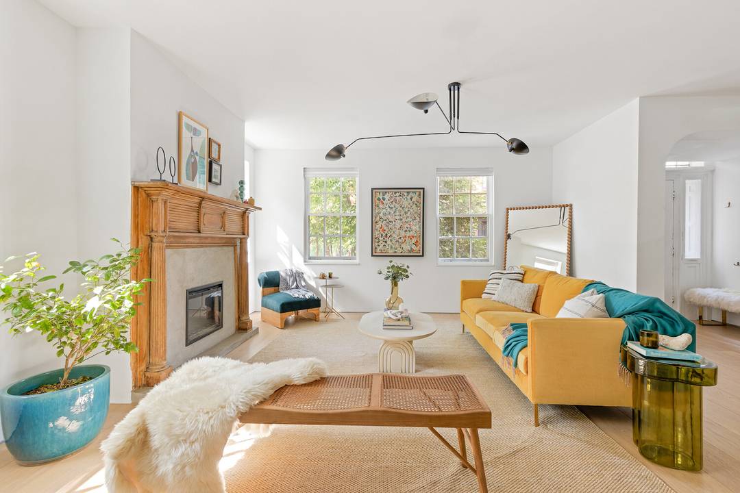 24 Middagh Street is a rare two family Brooklyn Heights compound featuring a fully rebuilt main house, a separate carriage house, and private parking, all centered around a private courtyard.