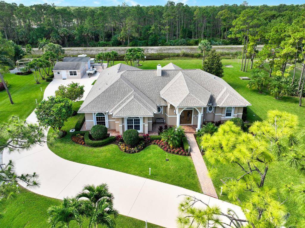 Don't miss this incredible CBS house just a few miles from the beautiful beaches of Jupiter on a 1.
