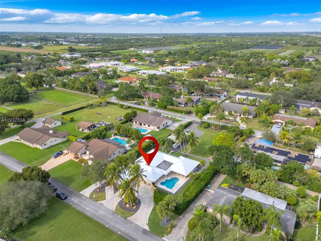 Custom Built, Fully Updated Home featuring a split plan layout with 4 bedrooms and 3 bathrooms, a heated pool, and a spacious covered patio with high end finishes ideal for ...