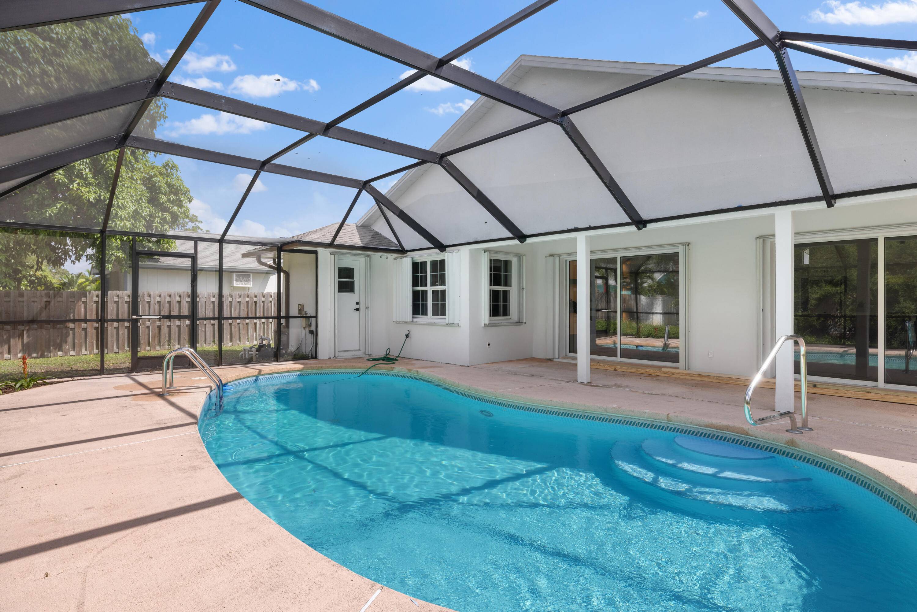 ABSOLUTELY GORGEOUS FULLY RENOVATED SINGLE FAMILY HOME PRIME VERO BEACH LOCATION NEW 2025 ROOF OVERSIZED LOT Bright Open Split Floor Plan LED Recessed Lighting Wainscoting Built Ins Fireplace Customer Bar ...