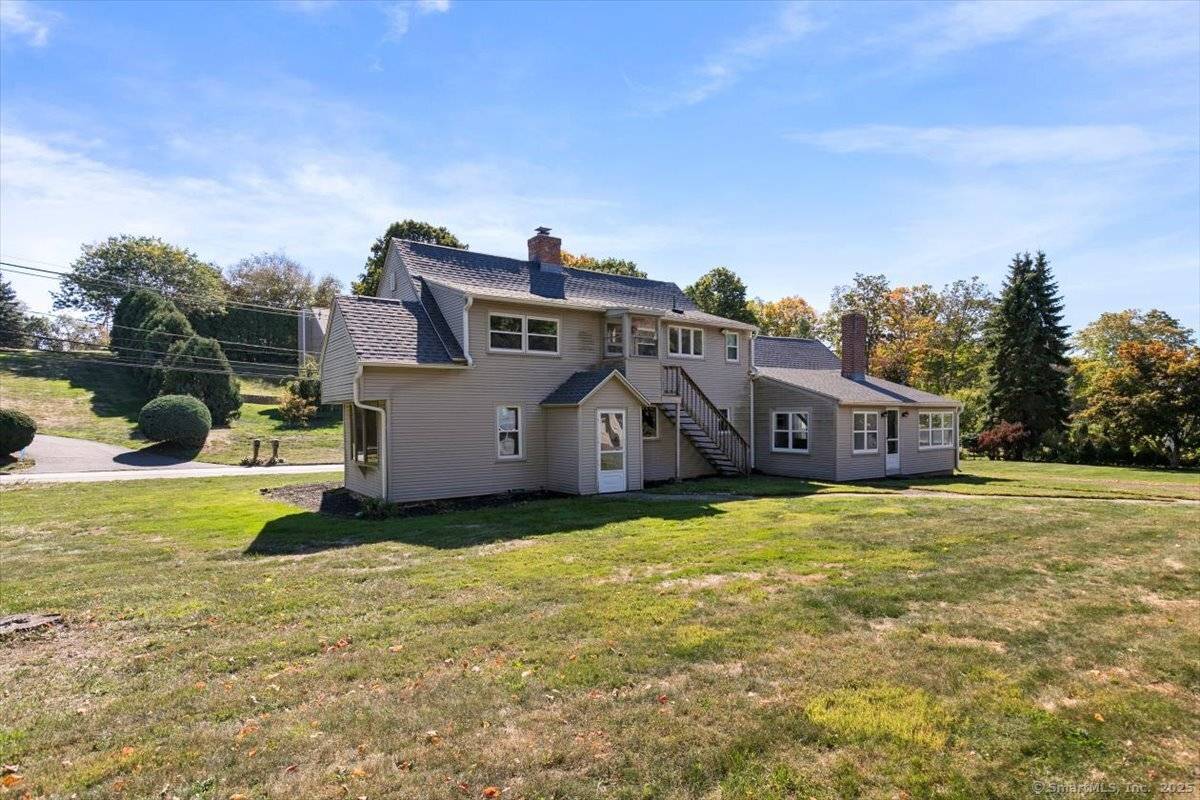 This 2, 702 sq ft Cape style home sits on a private 1.
