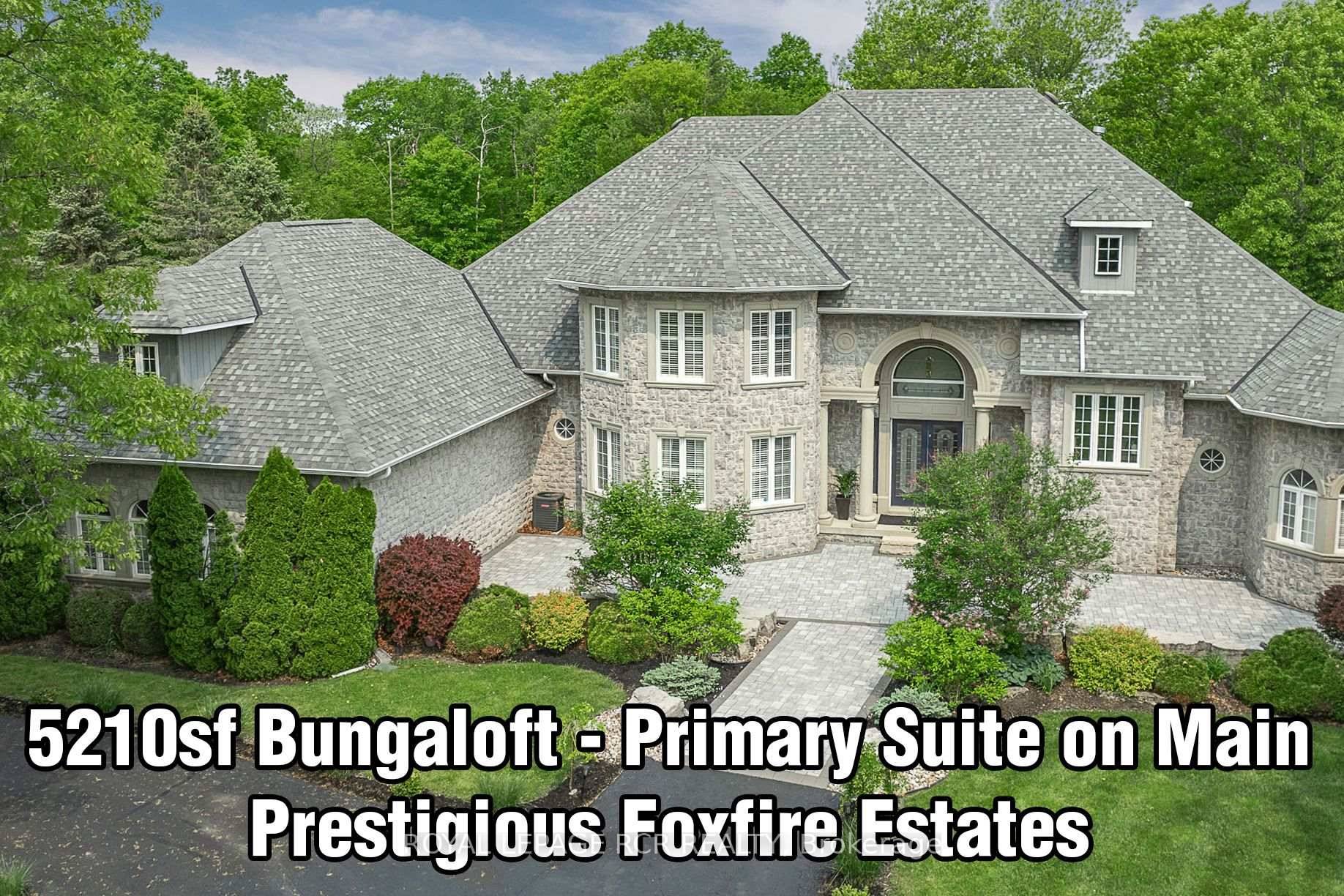 Enjoy an elevated lifestyle in this 5210sqft 8258sf of living space 4 2 Bedroom custom, stone BUNGALOFT estate with soaring ceilings, main floor Primary Suite, finished walk out Basement, Smart ...