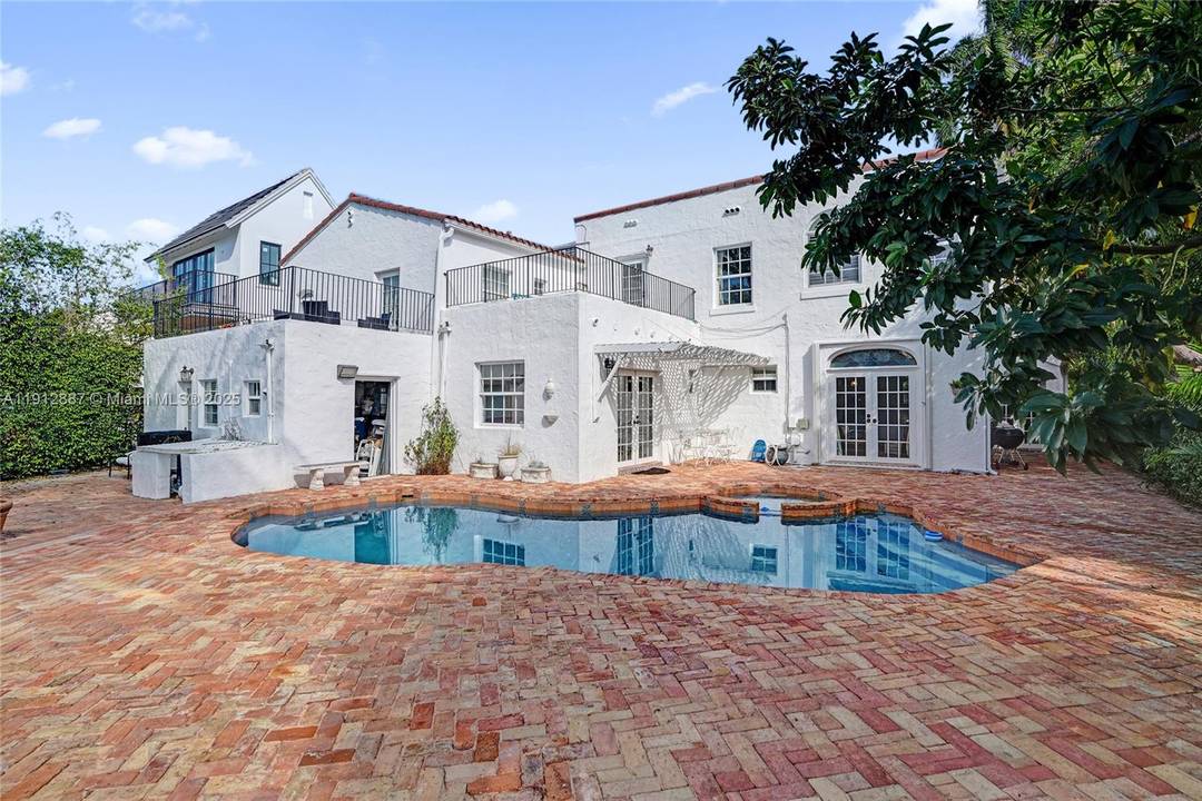 Villa Mica, a timeless beauty built ahead of its time boasting 10 ft ceilings, abundant impact windows, and expansive floor plan that continues to preserve its original Miami Beach charm, ...