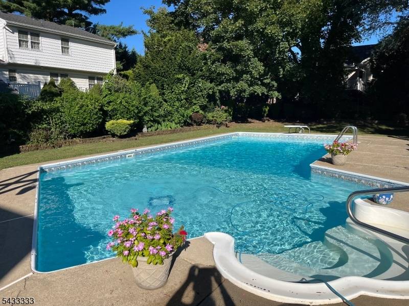 Set on a generous. 28 acre property in the heart of Cranford, this 4 bedroom, 2.