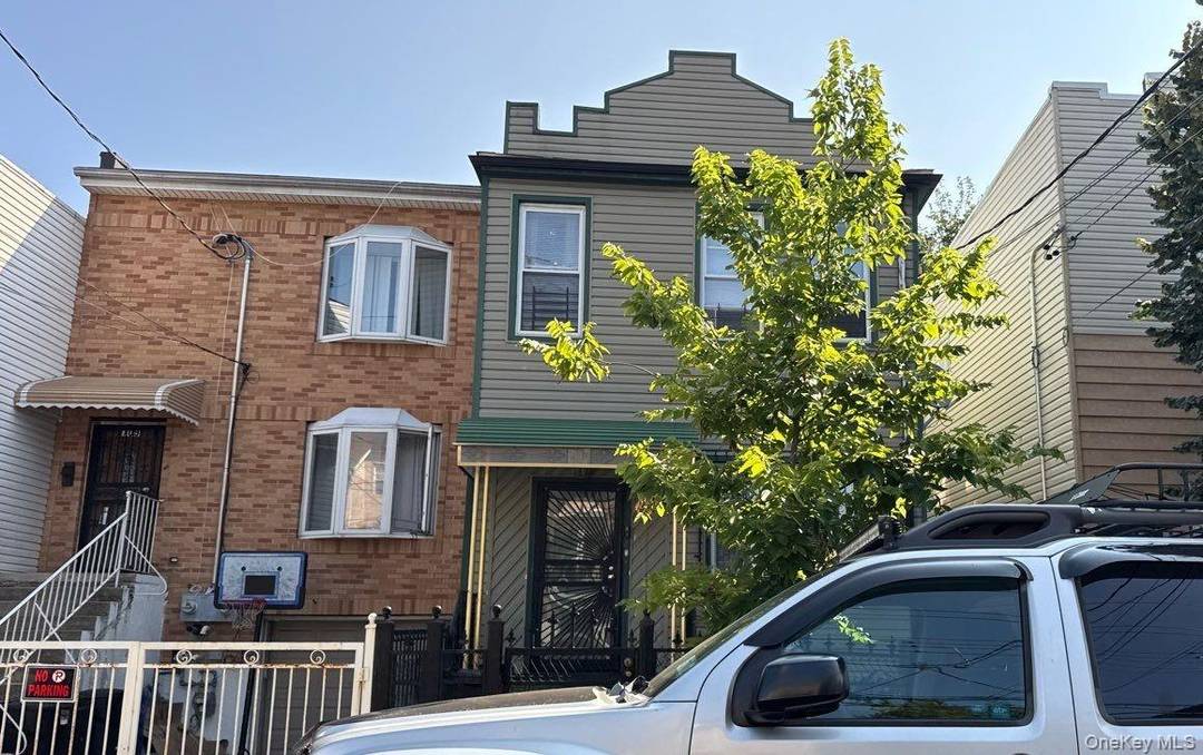 This Duplex Style Home Features 5 Bedrooms, 2 Full Baths, 2 Eat In Kitchens and Basement.