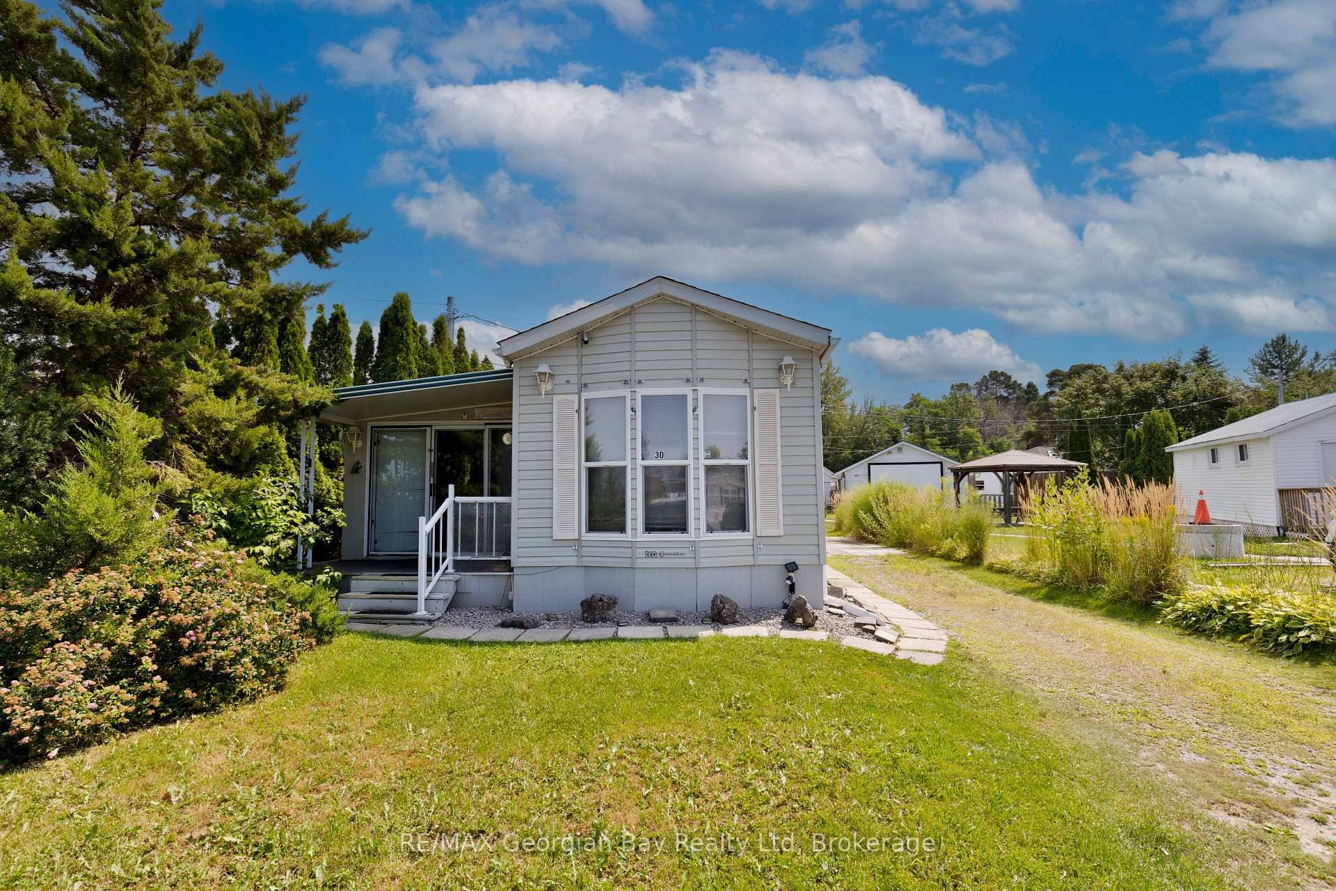 Price is Right ! This well kept 2 bedroom mobile retreat offers a living and dining room combination, 4 piece bath, cozy gas fireplace, gas heat, and central air.