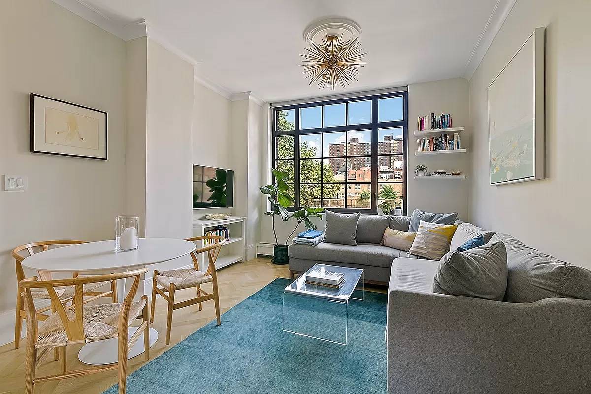 A Paris Forino designed split two bedroom, two bath gem is exquisitely finished with solid white oak herringbone wood flooring and crown moldings throughout.